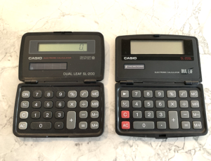 Casino SL-200 solar and SL-200L twin-power calculators. The newer one won't work without a fresh battery.