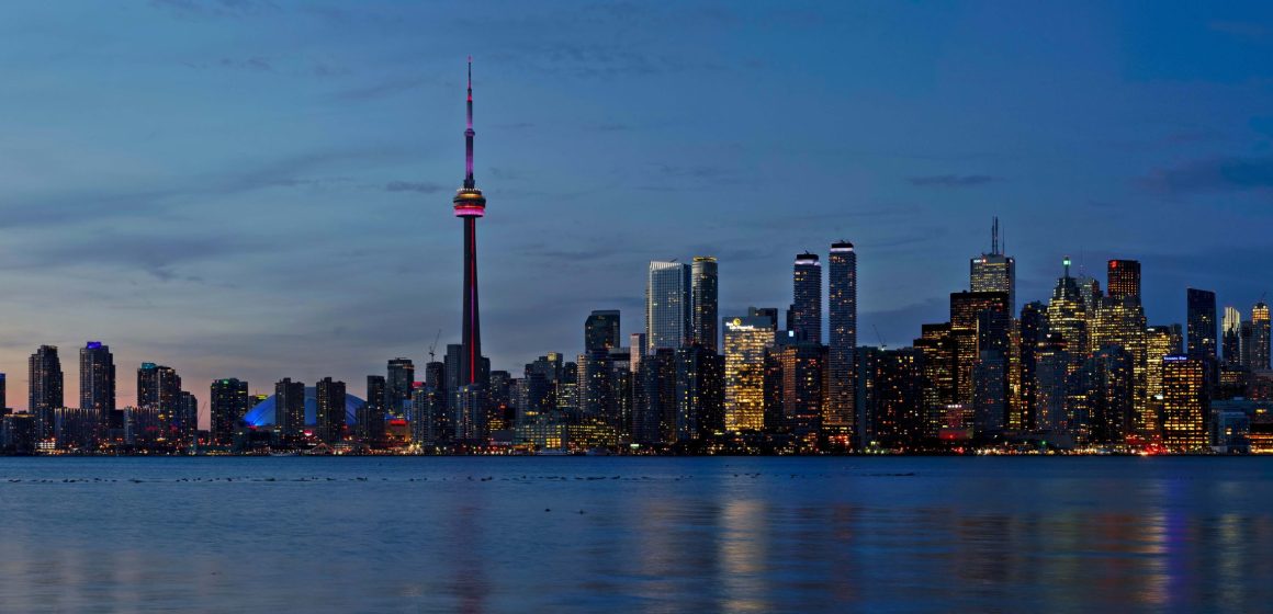 SKyline view of downtown Toronto at dusk from across Lake Ontario
